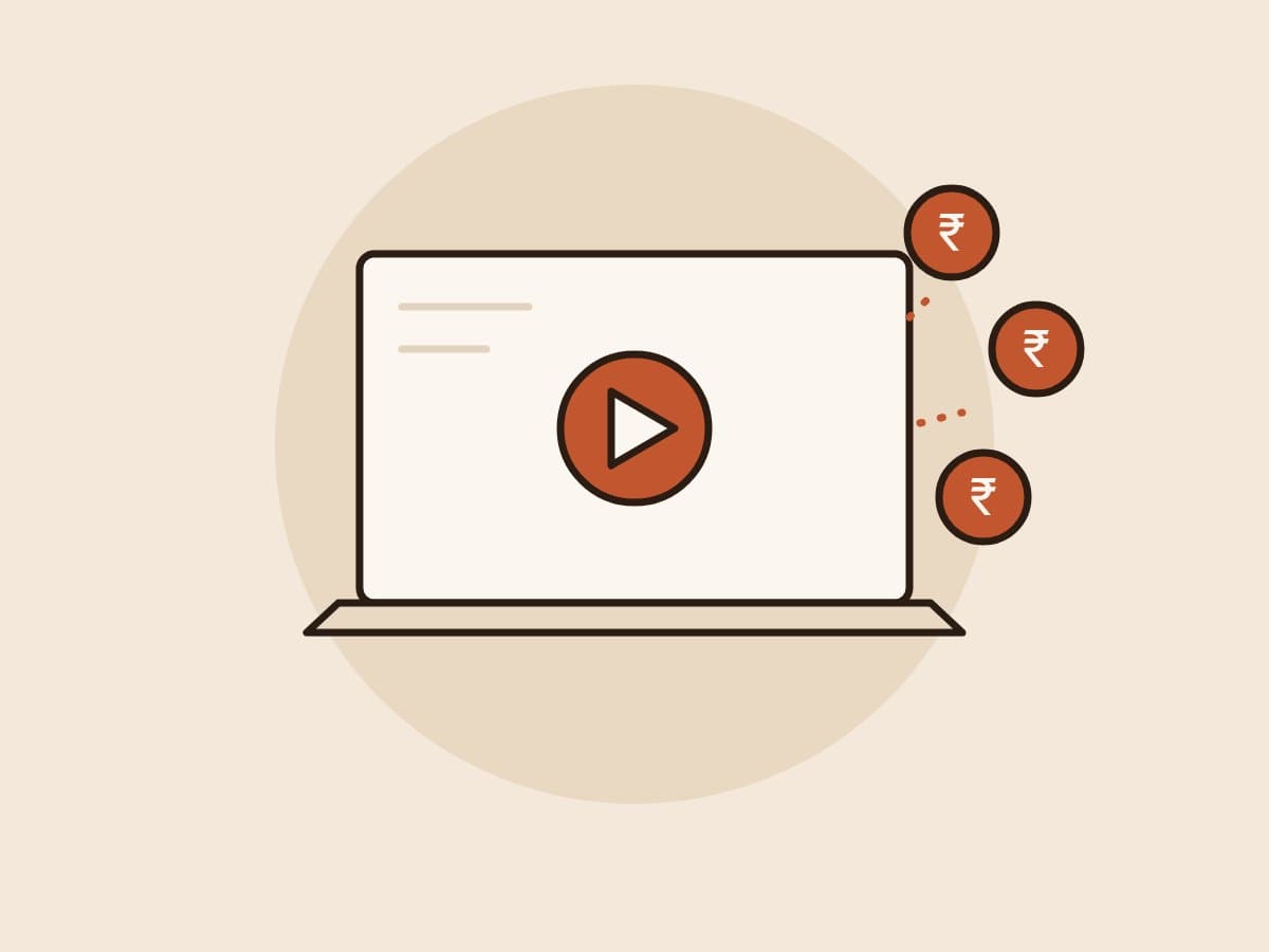 Illustration of an online class on a laptop with rupee coins flying out